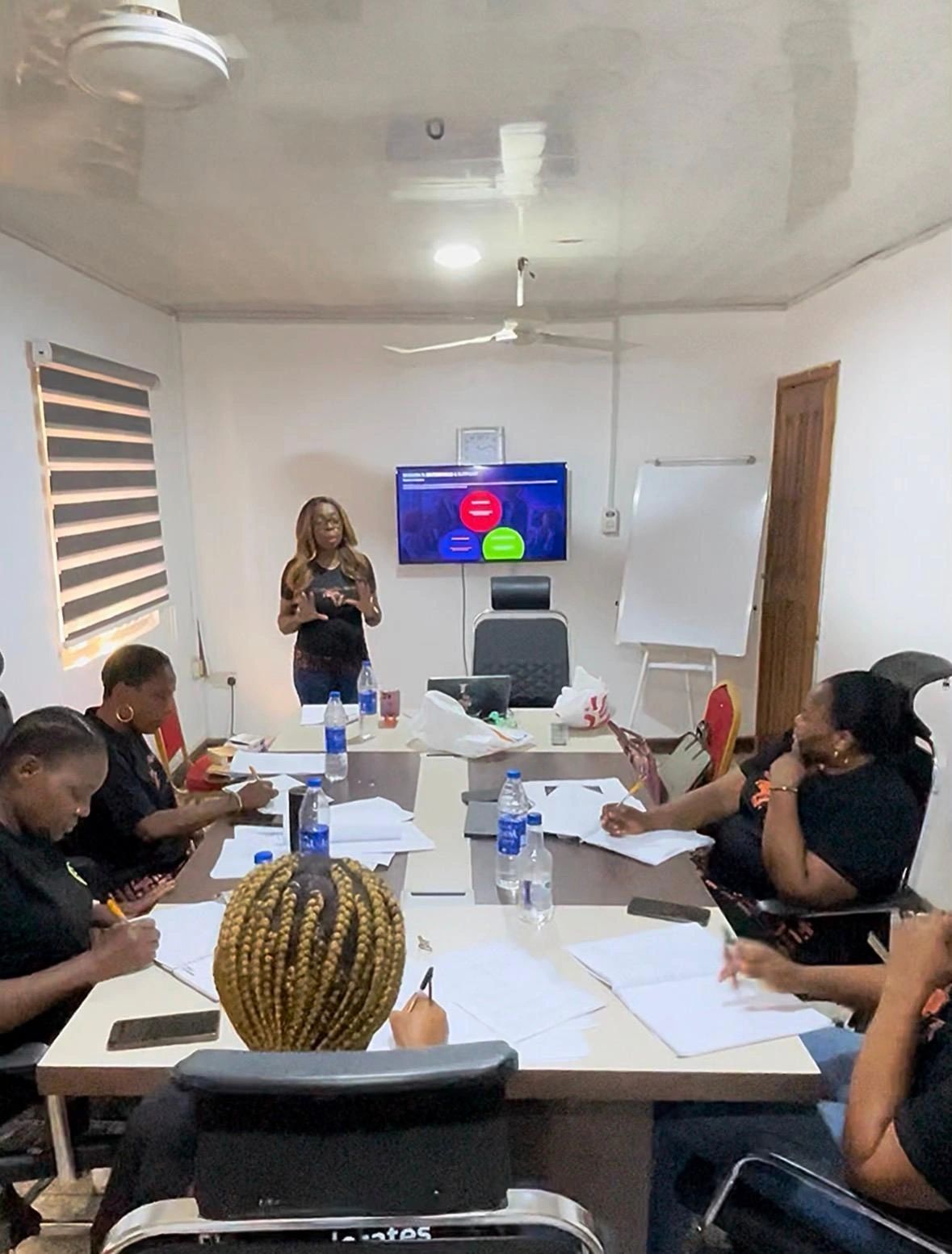 Professional woman presenting at an AccelerateHER Africa leadership workshop
